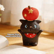 Apple Lucky Kitty black cat resin figure balancing a red apple