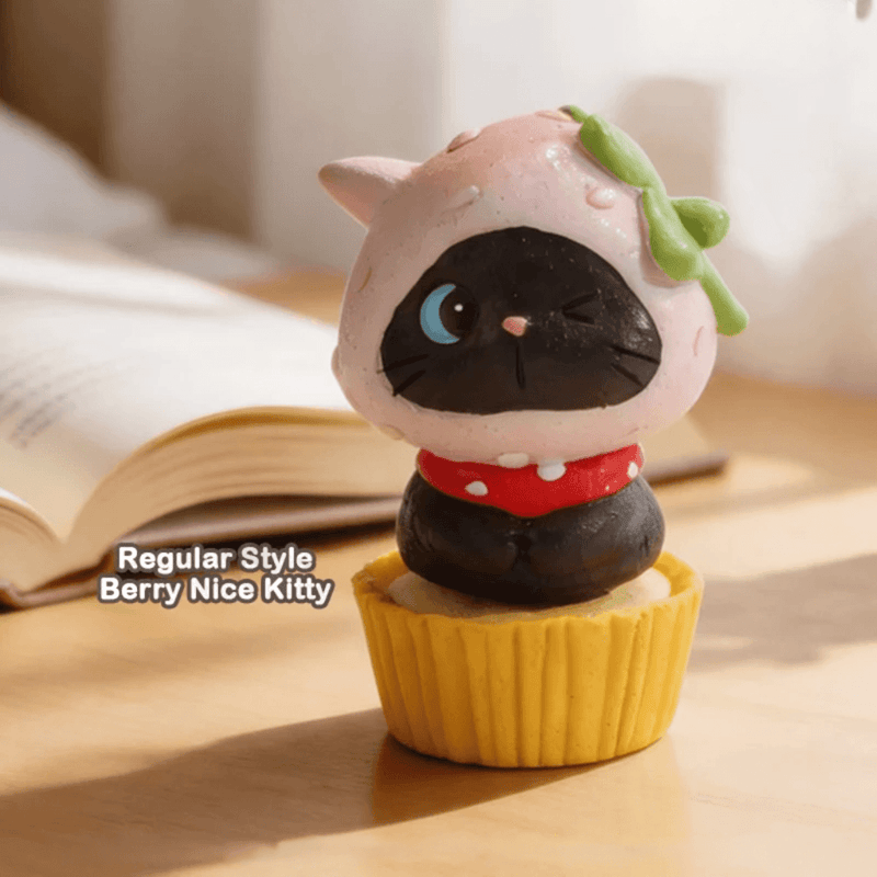 Berry Nice Kitty blind box figure wearing a pink fruit hood on a yellow base