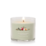 Yankee Candle Enchanted Orchard Signature tumbler scented candle lit, soft green wax, product image on white