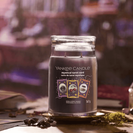 Yankee Candle Mystical Tarot Card Signature large jar scented candle on table, purple wax lifestyle image
