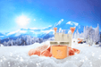 Slopeside Spritz candle on snowy alpine scene with grapefruit, fizz and roses
