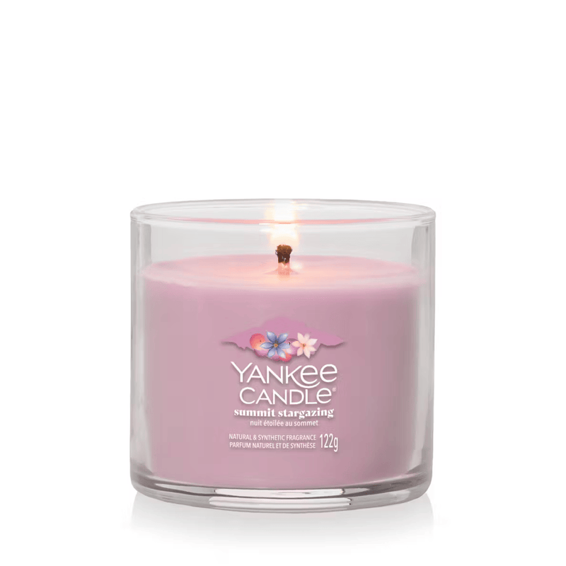 Summit Stargazing small tumbler candle lit, lilac wax in clear glass